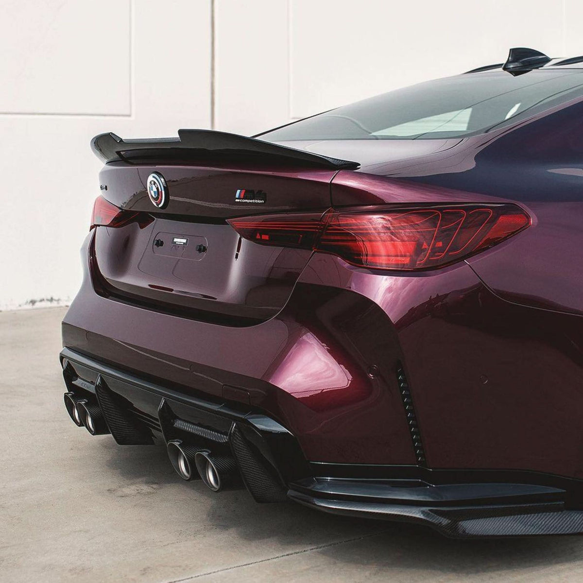 BMW 4 Series G22 G82 M4 PSM Style carbon fiber trunk spoiler by K2 Industries, showing sleek aerodynamic design on the car's rear.