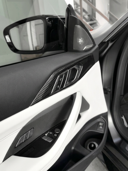 BMW 4 Series G82 G22 carbon fiber interior door trim set by K2 Industries, featuring sleek, textured carbon fiber panels for a modern look.