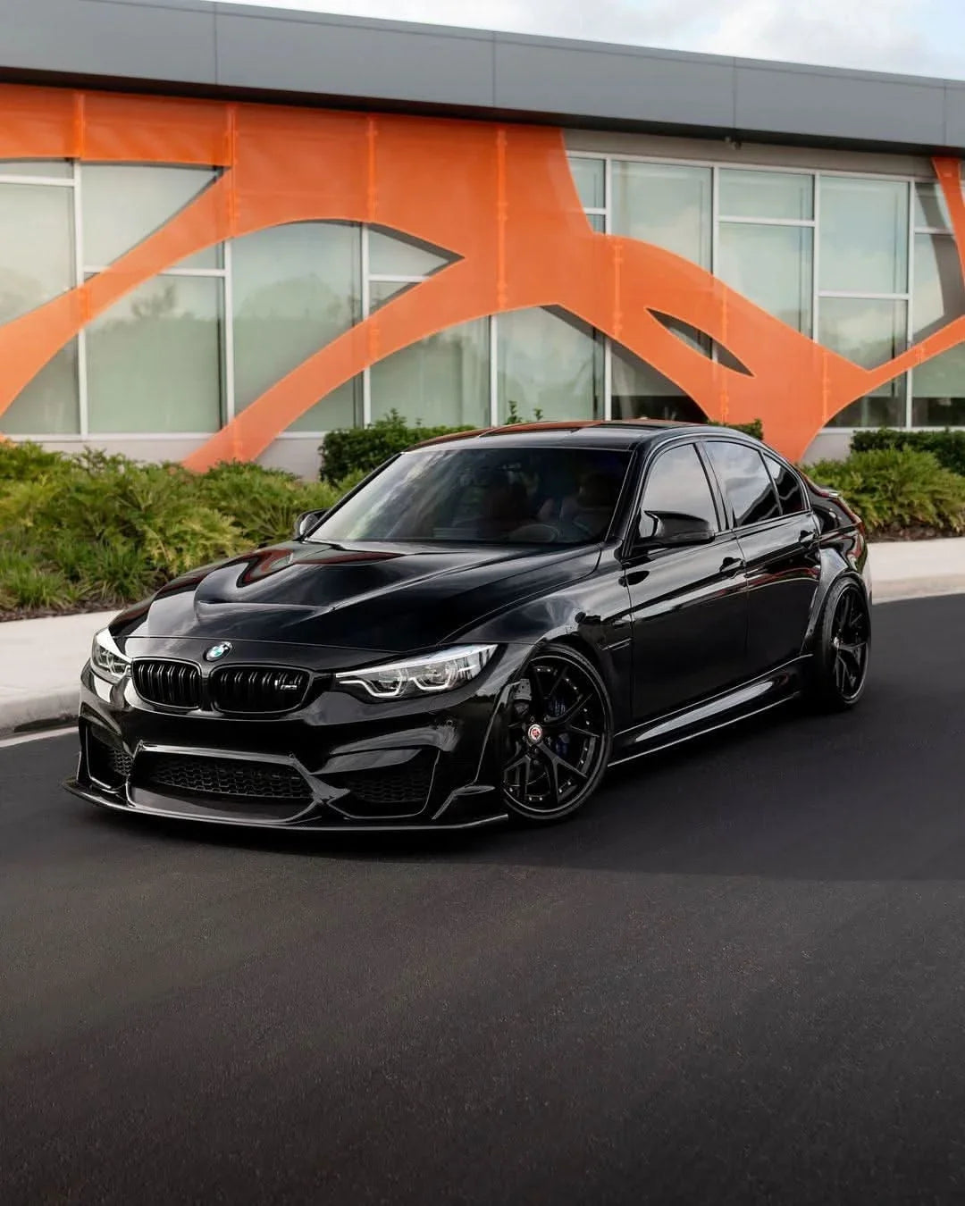 BMW 3 Series F30 F35 M3 F80 sedan carbon fiber trunk spoiler by K2 Industries, showing sleek, aerodynamic design on vehicle rear.