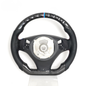 Vekto carbon fiber steering wheel for BMW E90 E92 E93 2009-2020, close-up view showing textured carbon fiber surface.