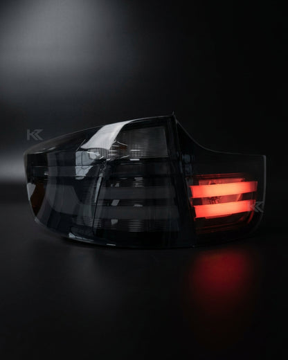 BMW X6 E71 tail lights with red and smoked LED upgrade by K2 Industries, showing the sleek design and illuminated LED sections.