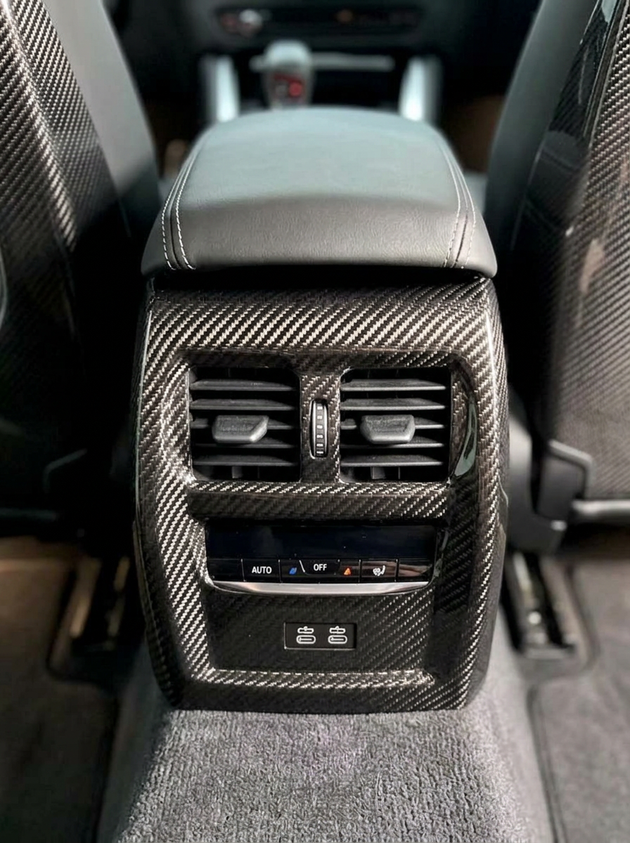 BMW 3 Series G80 G82 M3 M4 carbon fiber rear console trim, interior accessory by K2 Industries, showcasing sleek textured finish