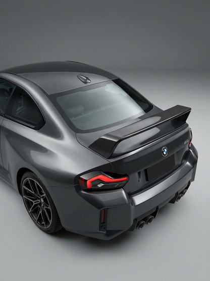 BMW 2 Series G87 M2 carbon fiber MP style wing by K2 Industries, showcasing sleek, aerodynamic design on the car.
