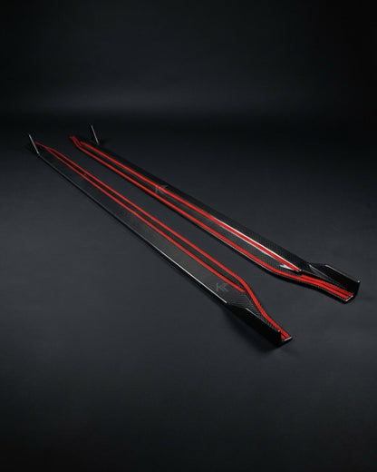 BMW M3 G80 and M4 G82 side skirt extensions in black dry carbon fiber, designed for sporty aerodynamic enhancement.
