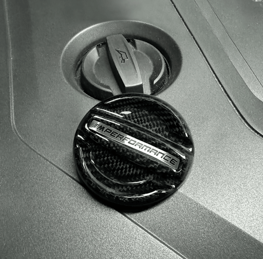 BMW MPerformance carbon fiber engine oil cover by K2 Industries, showcasing a sleek, lightweight carbon fiber engine oil cap.