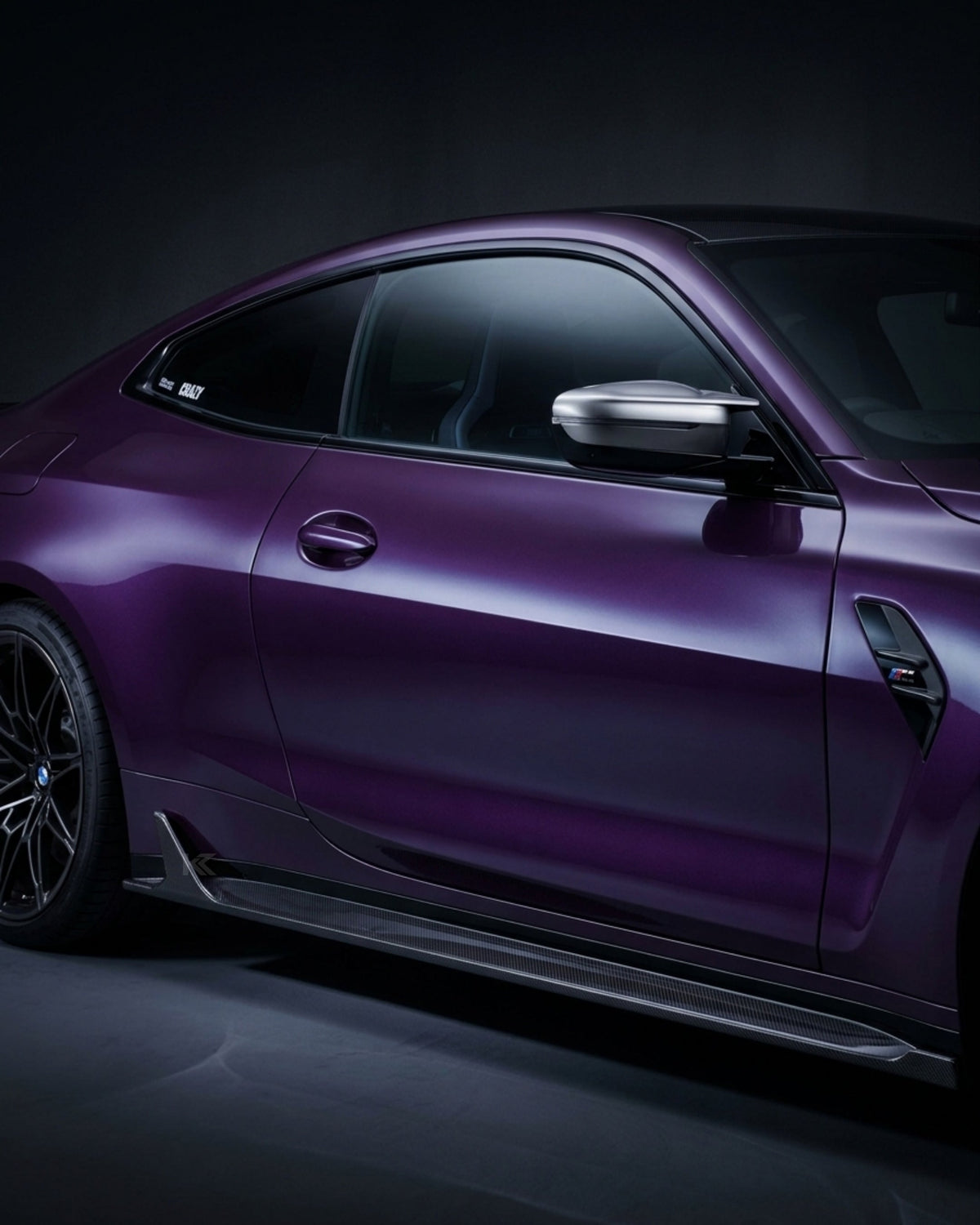 BMW M4 G82 G83 side skirt extensions in pre-preg dry carbon fiber by K2 Industries, showcasing sleek aerodynamic design.