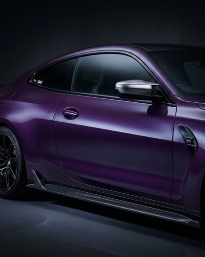 BMW M4 G82 G83 side skirt extensions in pre-preg dry carbon fiber by K2 Industries, showcasing sleek aerodynamic design.