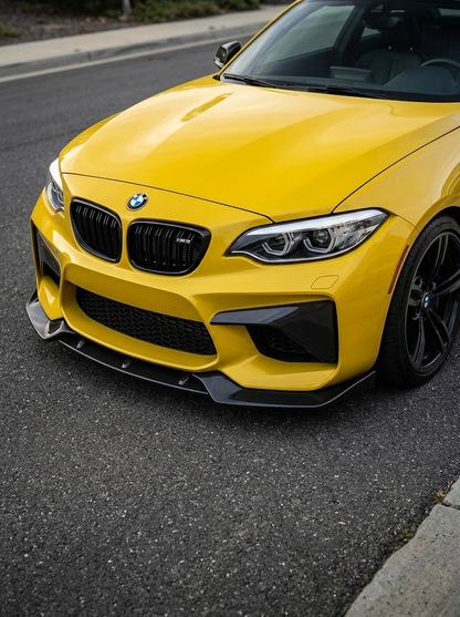 BMW 2 Series F87 M2 Carbon Fiber Front Lip by K2 Industries installed on front bumper, showcasing sleek black carbon fiber finish.