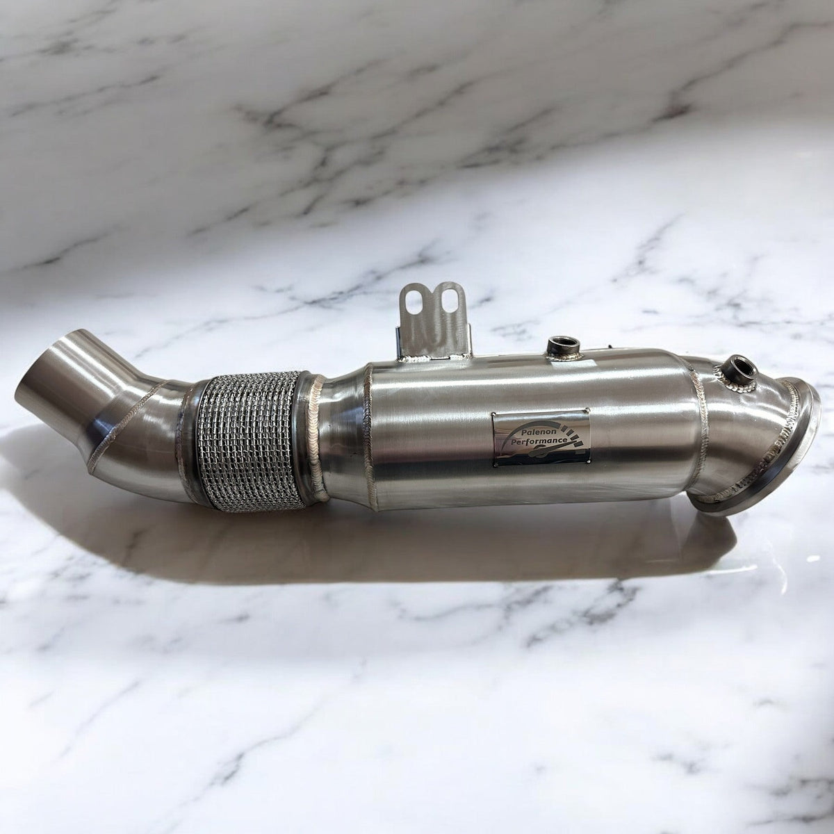 Palenon Performance 5 Inch B58 Downpipe for BMW Supra, M340i, M440i, X5, X7, and other B58 models showing the metal pipe and flanges.