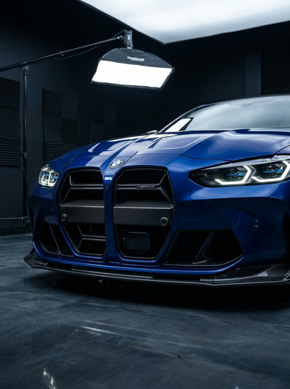 K2 Industries BMW M3 G80 M4 G82 CSL style carbon fiber front grille, sleek and textured for 2021-2023 models, with detailed weave pattern.
