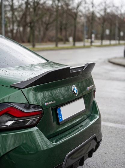 BMW 2 Series G42 MP Style carbon fiber spoiler by K2 Industries, showcasing the sleek, aerodynamic design on a 2022+ model.