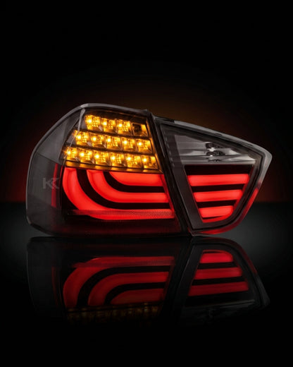 BMW 3-Series E90 tail light upgrade by K2 Industries, showing sleek red and clear lens tail lights for models 2006-2009.