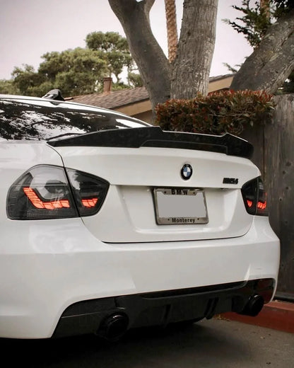 BMW 3 Series E90 M3 GTS OLED tail lights by K2 Industries, featuring sleek black housing and illuminated OLED light strips.