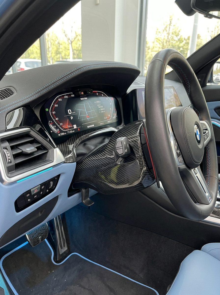 K2 Industries carbon fiber steering column cover for BMW 3 Series G80 G81 M3 and 4 Series G82 G83 M4, sleek and lightweight design.