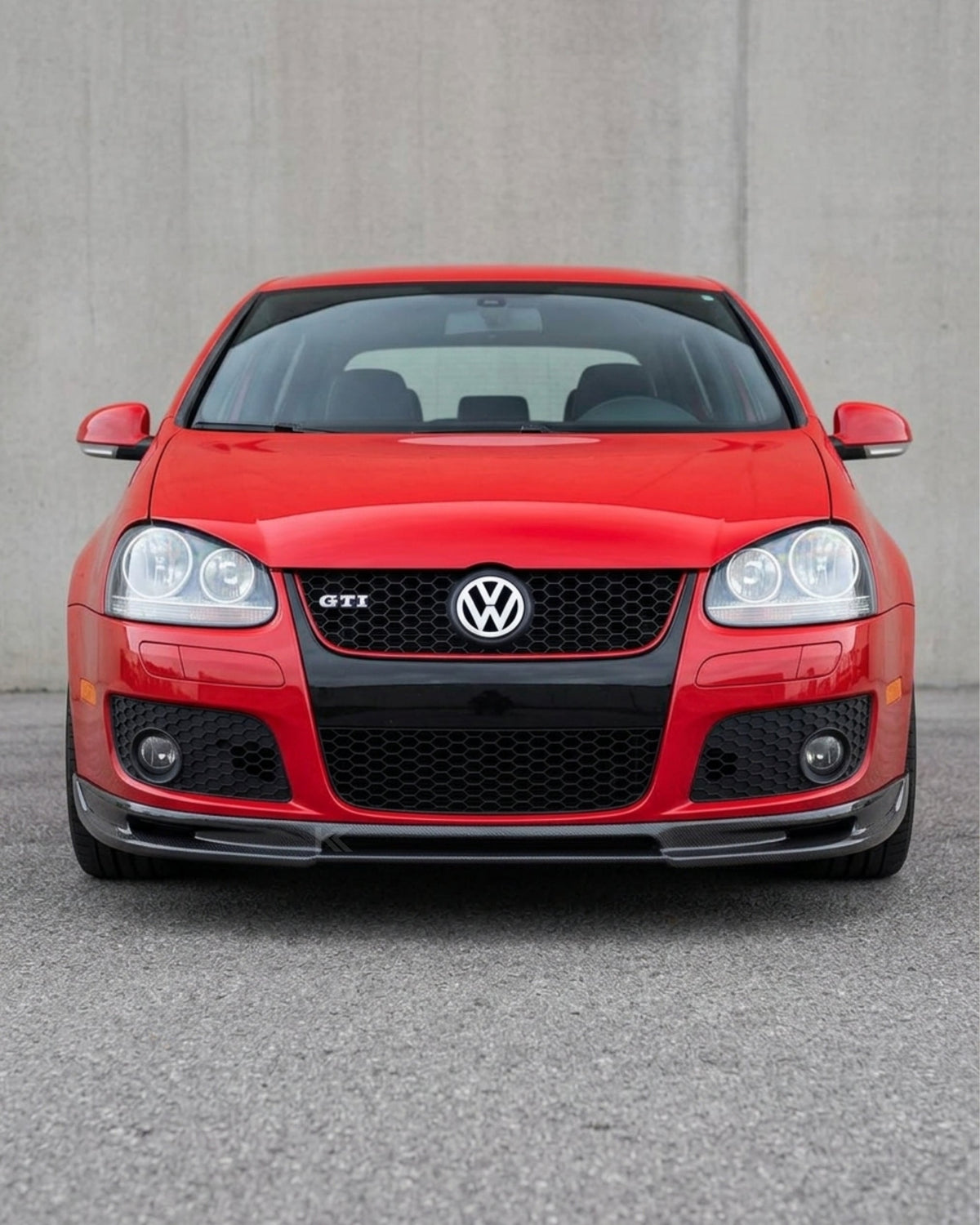 Volkswagen Golf GTI MK5 front bumper splitter in carbon fiber, designed for 2006-2009 models, by K2 Industries.