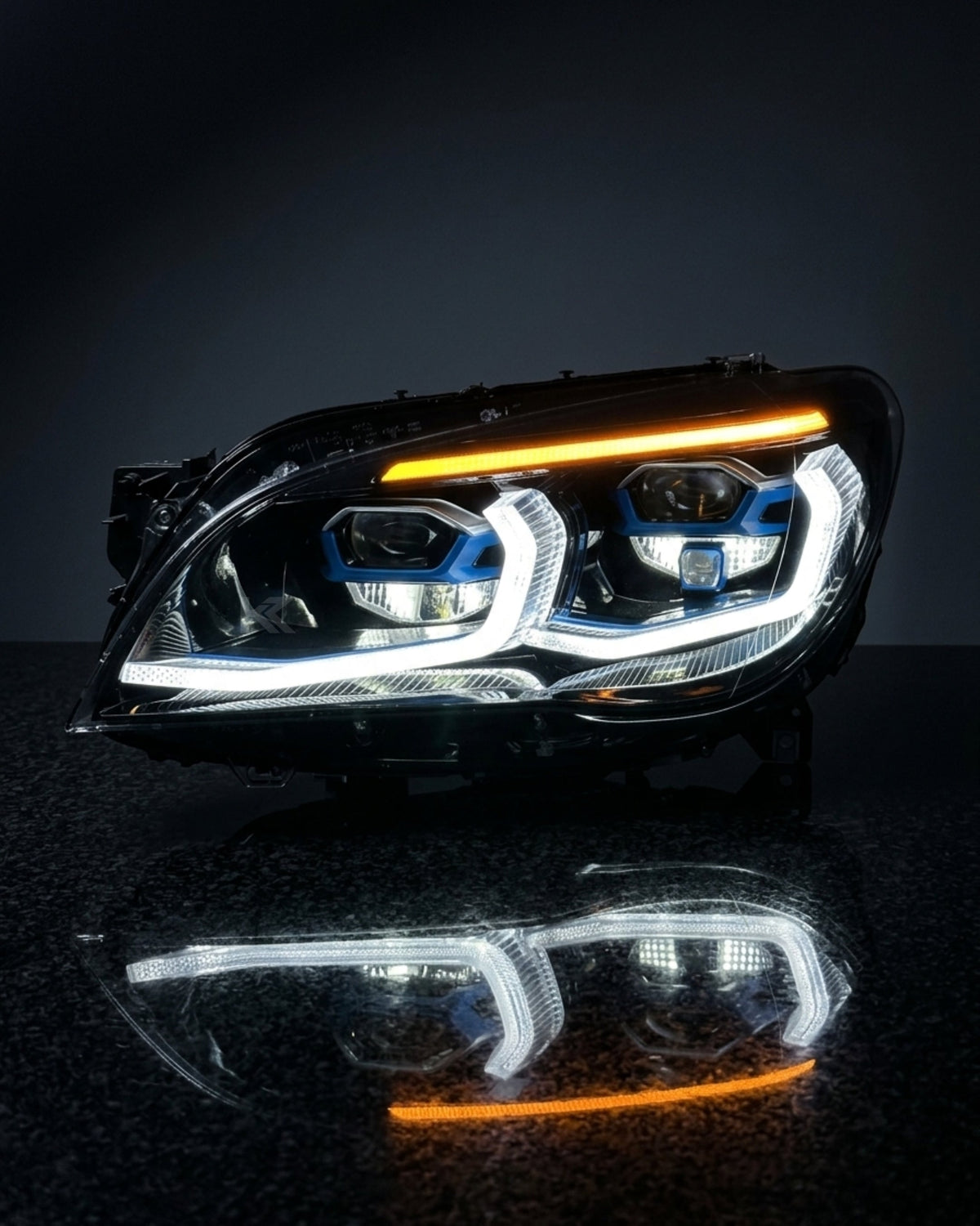 BMW 7 Series F02 G12 style LED headlight assembly with dual-color daytime running lights in yellow and white, from K2 Industries.