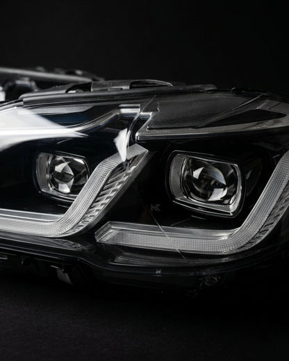 BMW 5-Series F10/F18 headlights with G30 style design by K2 Industries, featuring modern LED and projector elements.