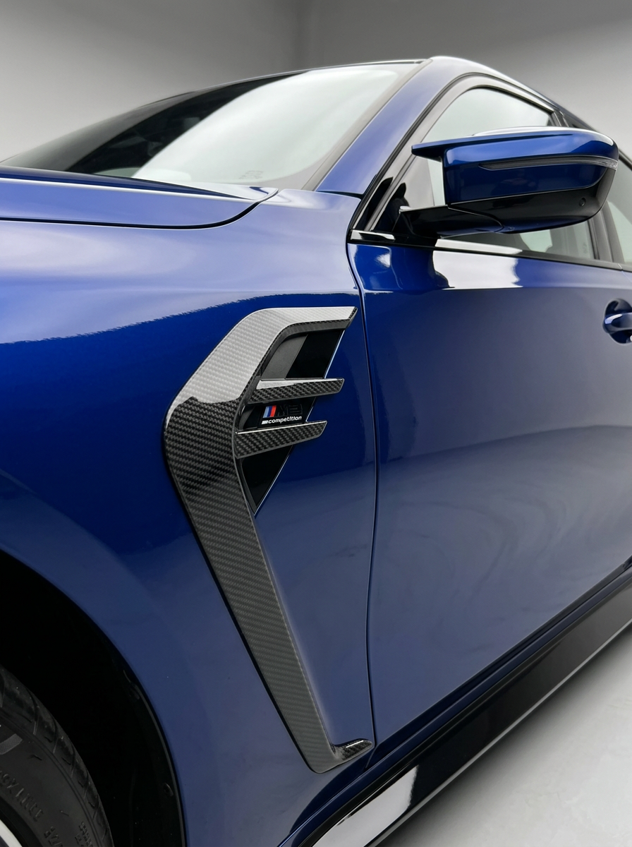 BMW 3/4 Series G80/G81/G82/G83 dry carbon fiber Fender Vents by K2 Industries, shown installed on car fenders.