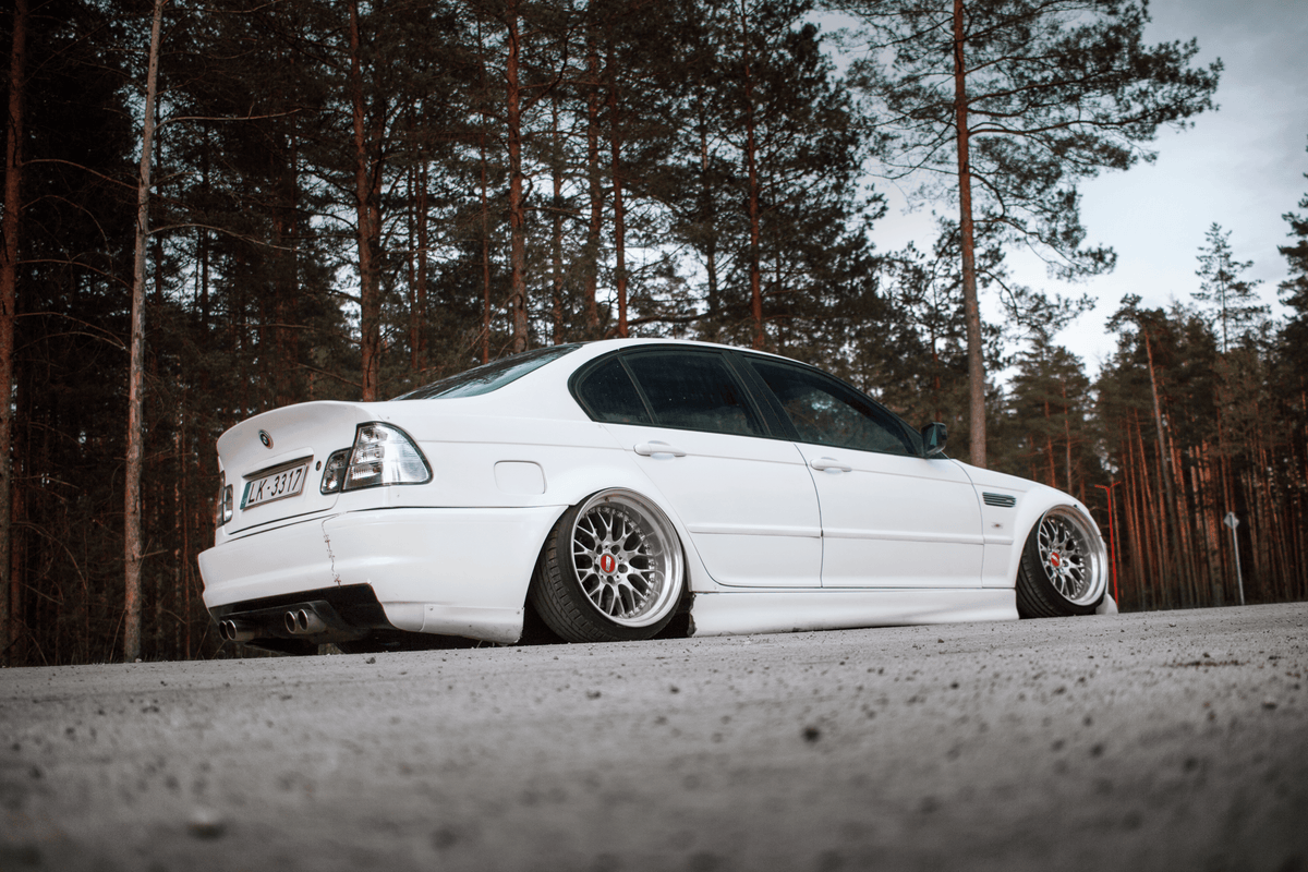 BMW 3-Series E46 sedan clear tail lights by K2 Industries, showing the set installed on the vehicle with a focus on the lens design.