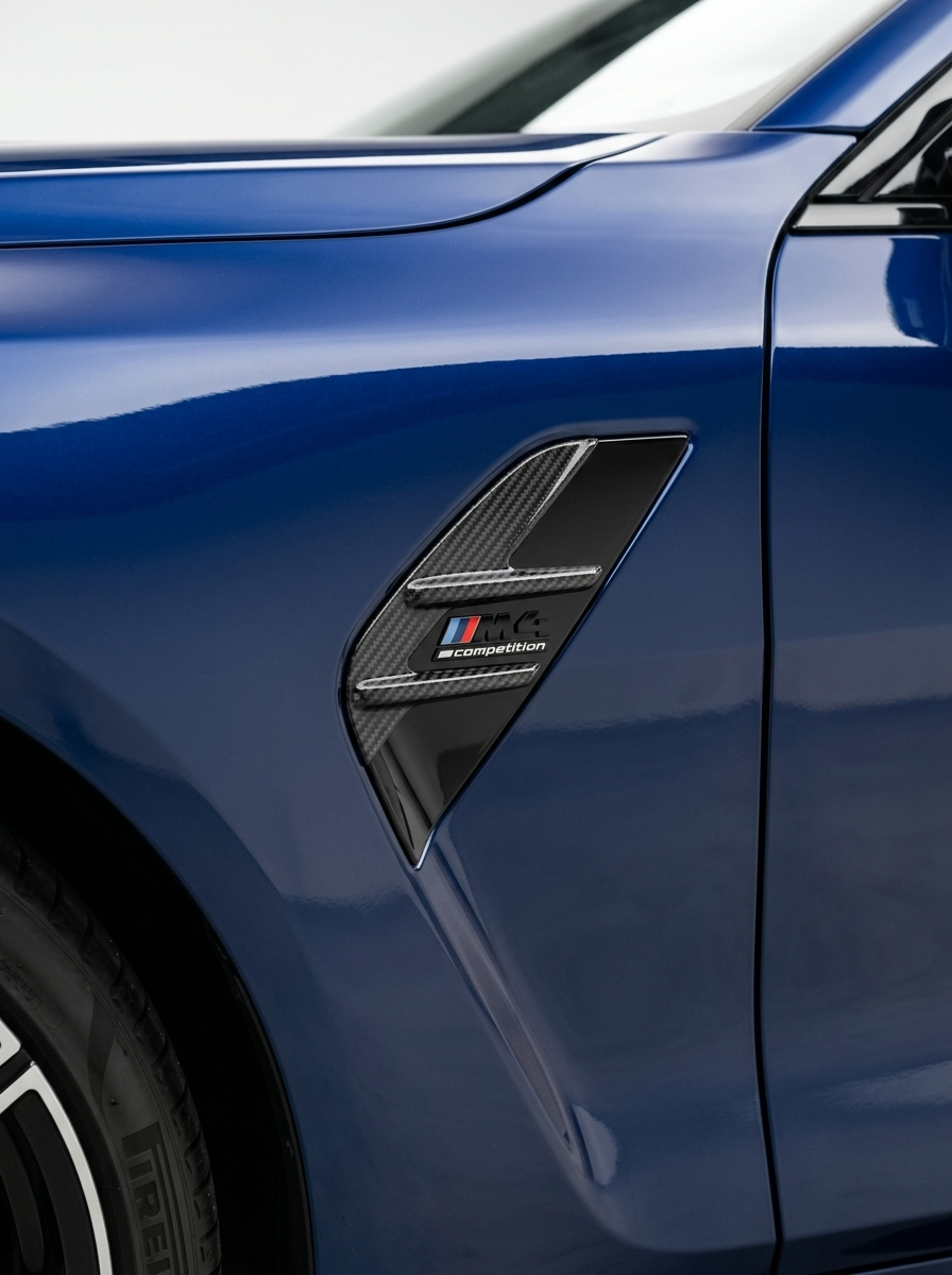 BMW 3/4 Series G80/G81/G82/G83 carbon fiber fender vents by K2 Industries, showing sleek, textured vents on the vehicle's front fenders.