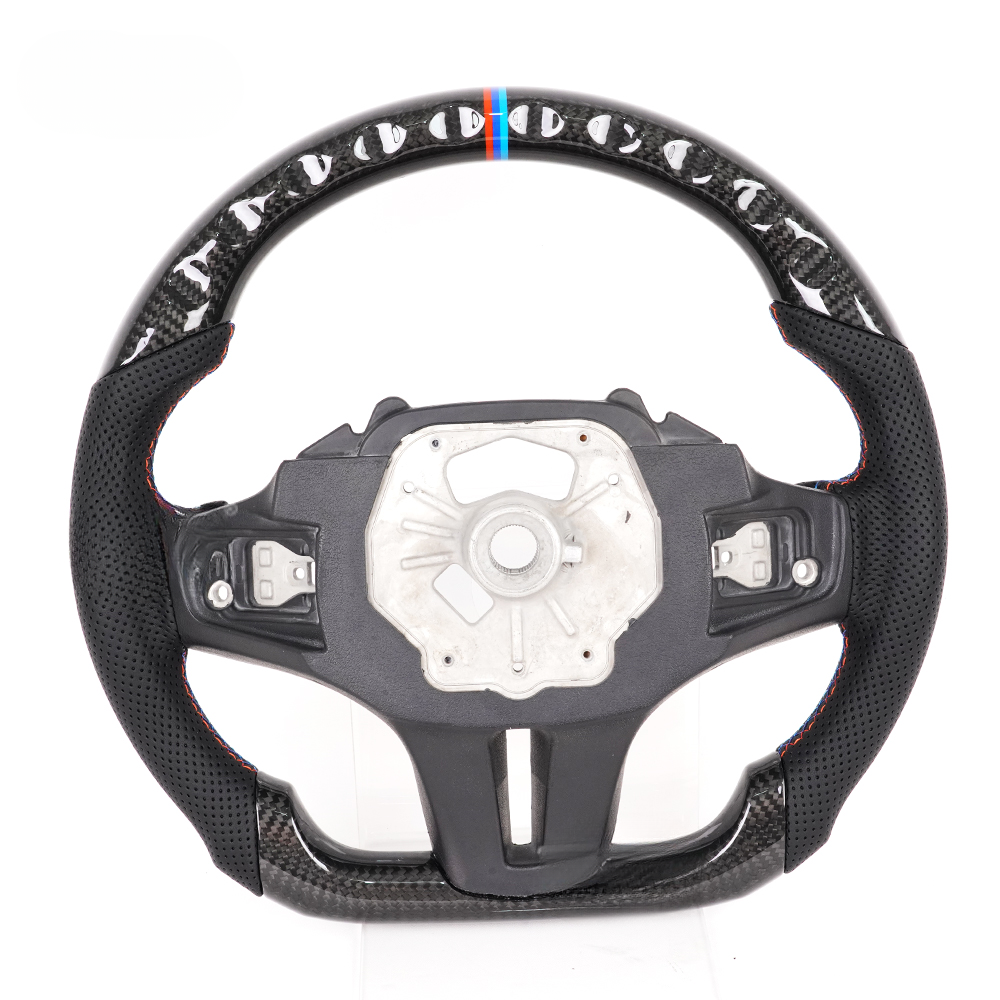 Vekto M Sport carbon fiber steering wheel for BMW G Series, close-up view showing textured carbon fiber finish and ergonomic grip.