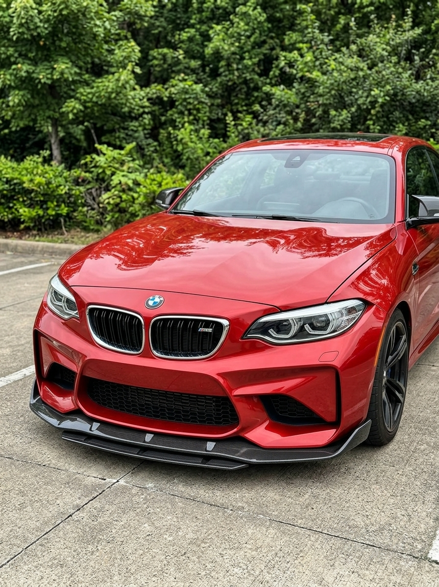 BMW 2 Series F87 M2 carbon fiber front lip by K2 Industries, designed for 2016-2019 models, shows sleek aerodynamic styling.