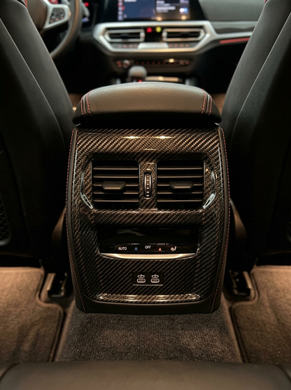BMW 3 Series G80 G82 M3 M4 carbon fiber rear console trim by K2 Industries, showcasing sleek interior enhancement.