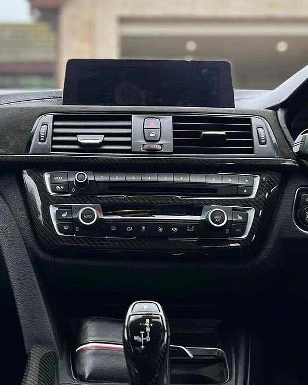 BMW 3 Series F30 carbon fiber radio cover trim by K2 Industries, showcasing sleek interior interior upgrade for models 2011-2019.