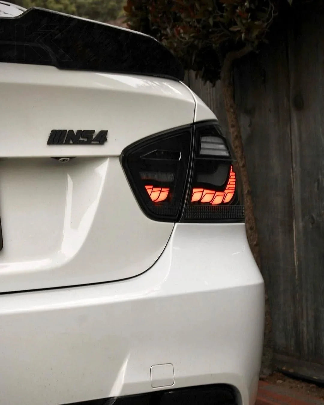 BMW 3 Series E90 M3 GTS OLED tail lights by K2 Industries, showcasing sleek red and clear lens design for 2006-2011 models.