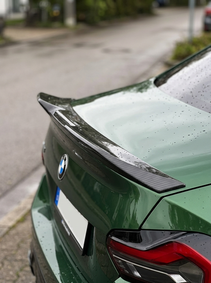 BMW 2 Series G42 MP Style carbon fiber spoiler by K2 Industries, showing sleek, glossy black aerodynamic design for 2022+ models.