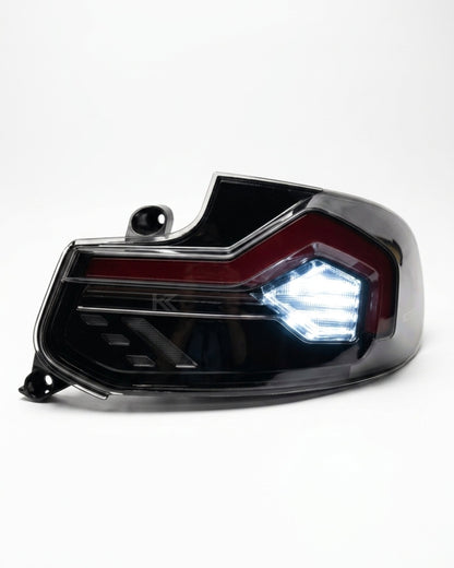 BMW 2-Series F22 F23 M2 F87 220i 225i F44 smoked LED tail lights by K2 Industries, showing close-up of illuminated rear lights.