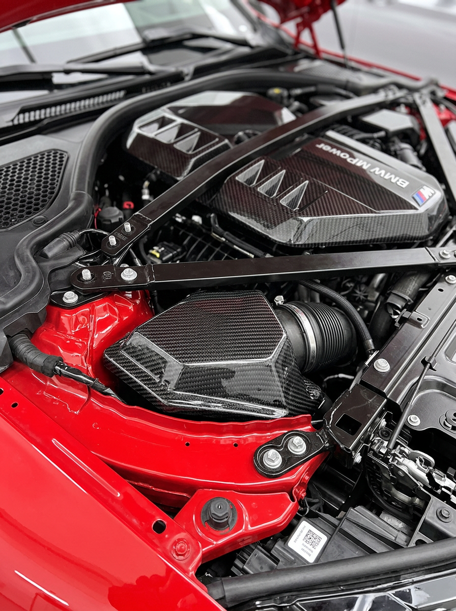 BMW 3/4 Series G80/G81/G82/G83/G87 carbon fiber ECU cover by K2 Industries, showcasing sleek, textured lightweight design.