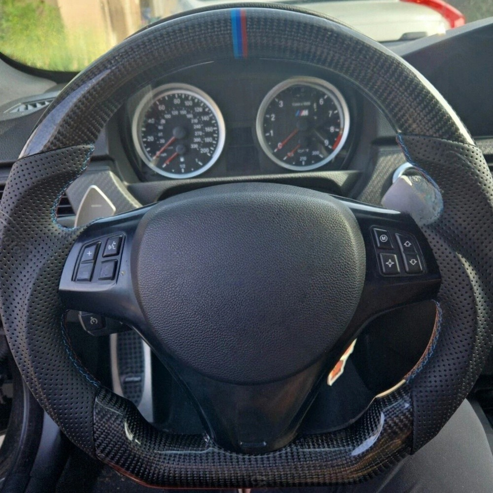 Vekto real carbon fiber steering wheel for BMW E90 E92 E93 M3 328i 335i 135i, showcasing sleek, lightweight design for sporty driving.