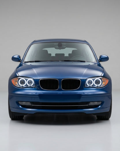 BMW 1 Series E87 headlights with LED angel eyes, K2 Industries brand, showing the front view with illuminated angel eye rings.