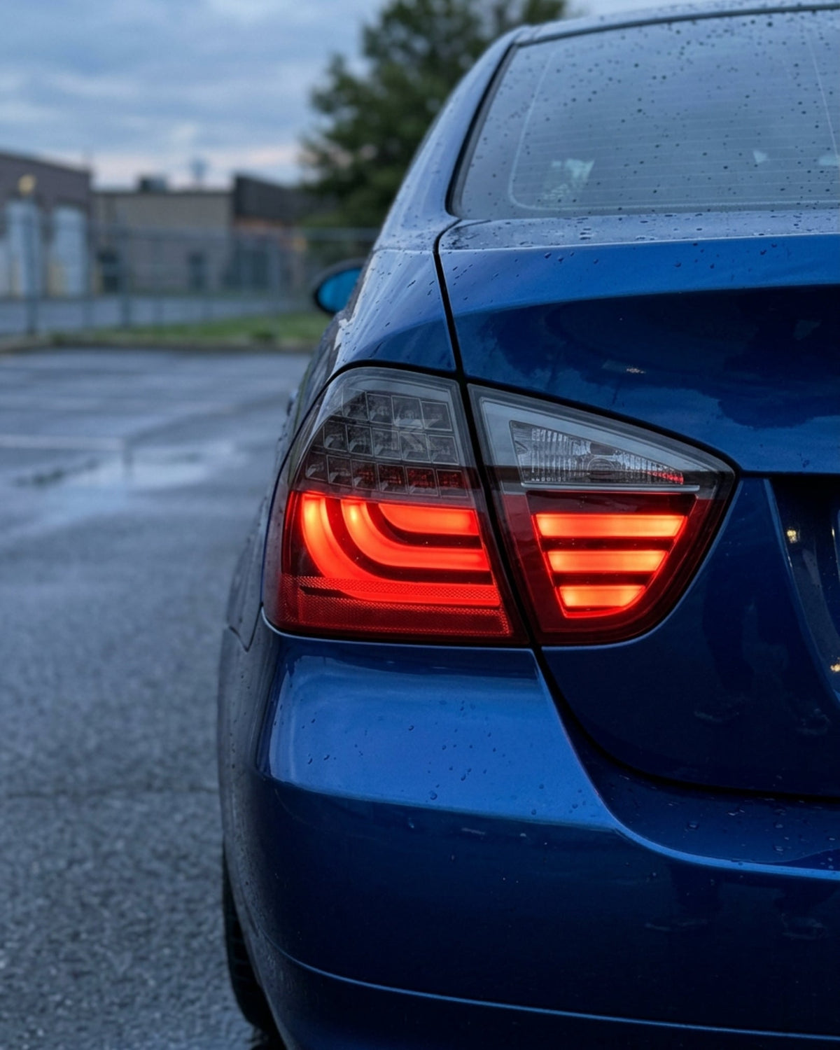 BMW 3-Series E90 tail light upgrade by K2 Industries, showing sleek, modern tail lights installed on a 2006-2009 vehicle.