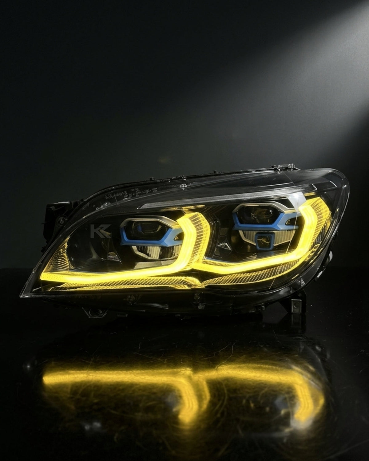 BMW 7 Series F02 G12 LED headlight assembly with dual-color yellow and white DRL, compatible with 2013-2015 models by K2 Industries.