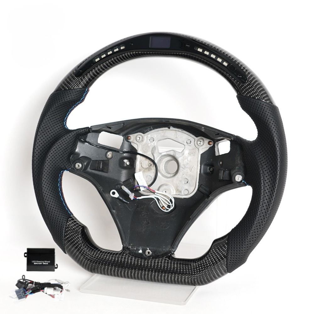 Vekto LED carbon fiber steering wheel for BMW E90 E92 E93 M3 328i 335i with paddle shifter cutouts, showcasing sporty design.