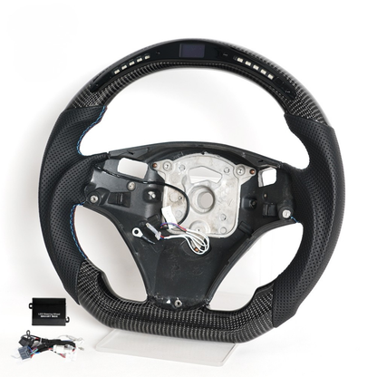 Vekto LED carbon fiber steering wheel for BMW E90 E92 E93 M3 328i 335i with paddle shifter cutouts, showcasing sporty design.