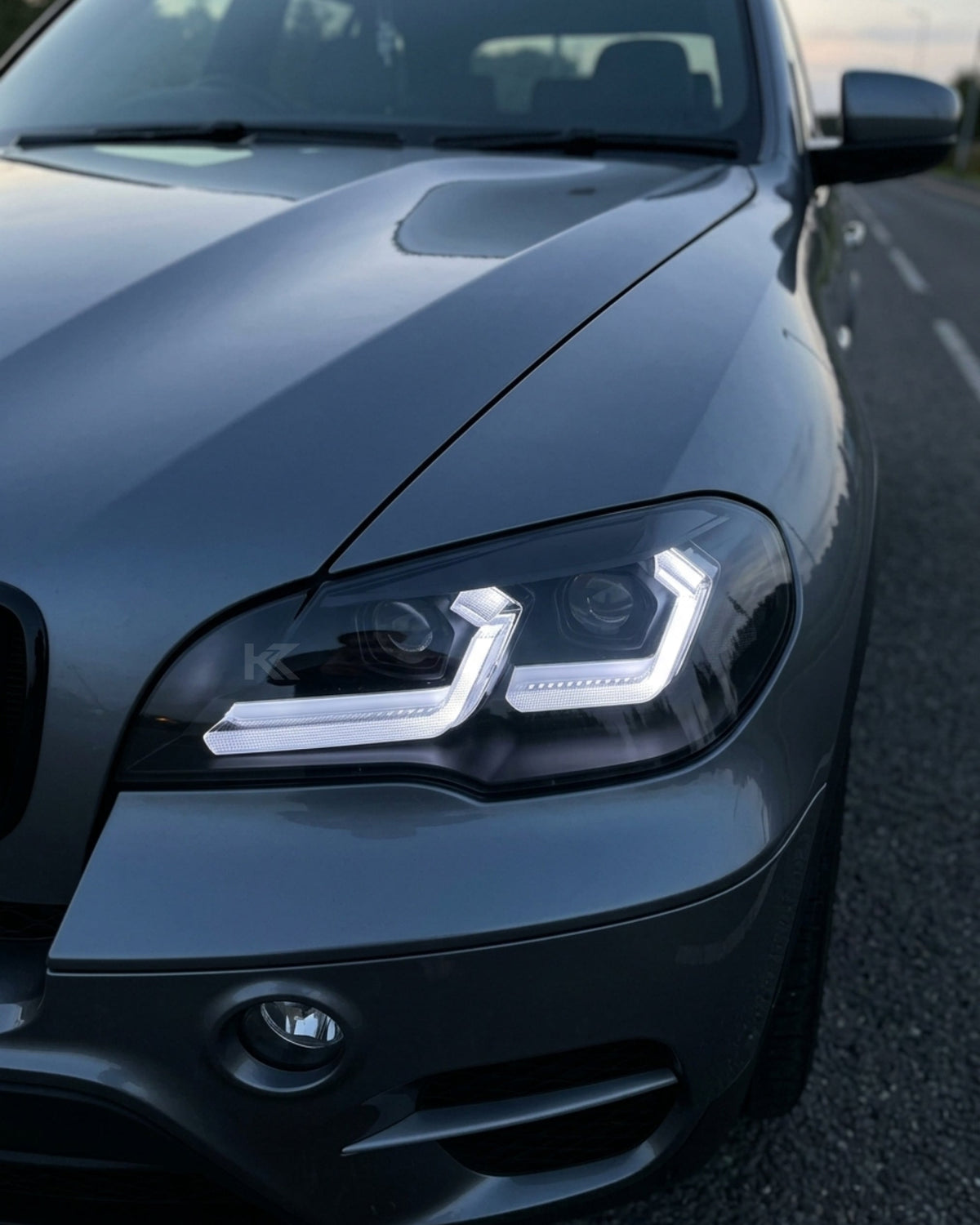BMW X5 E70 LED headlights by K2 Industries, featuring sleek modern design with bright LED light strips for 2007-2013 models.