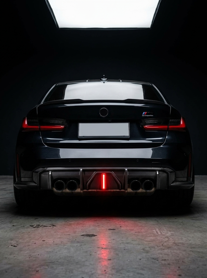 BMW 3 Series G80 M3 G82 G83 M4 carbon fiber rear diffuser with integrated LED lights, sleek aerodynamic design, by K2 Industries.