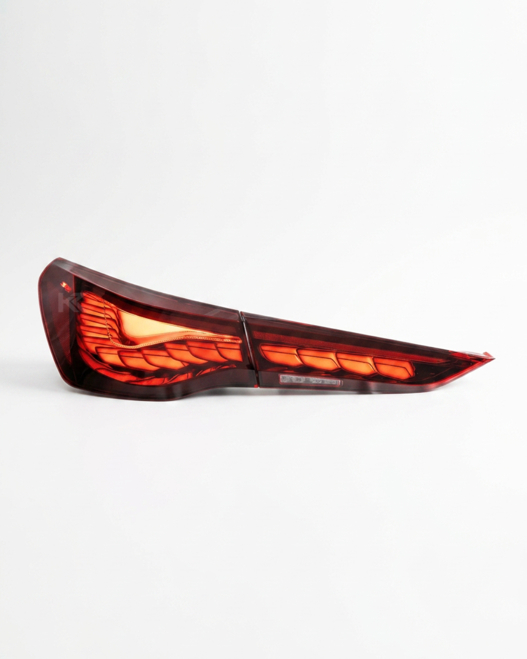 BMW 4-Series G22 G23 G82 M4 GTS OLED style LED taillight by K2 Industries, showing sleek red and clear sections.