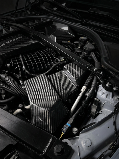 BMW 3/4 Series G80/G81/G82/G83/G87 carbon fiber ECU cover by K2 Industries, lightweight and stylish automotive engine bay accessory.