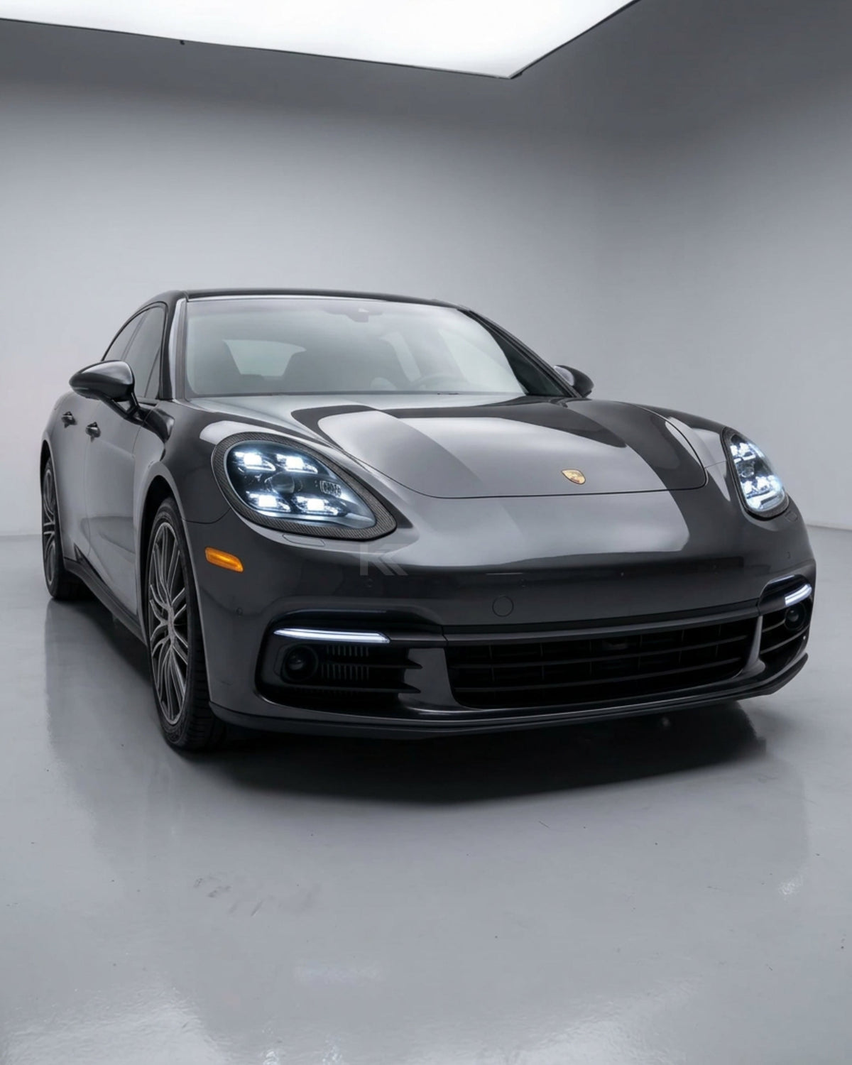 K2 Industries Porsche Panamera 970.1 LED headlight assembly with dual-color DRL for 2010-2013 models, showing the front view with illuminated lights.
