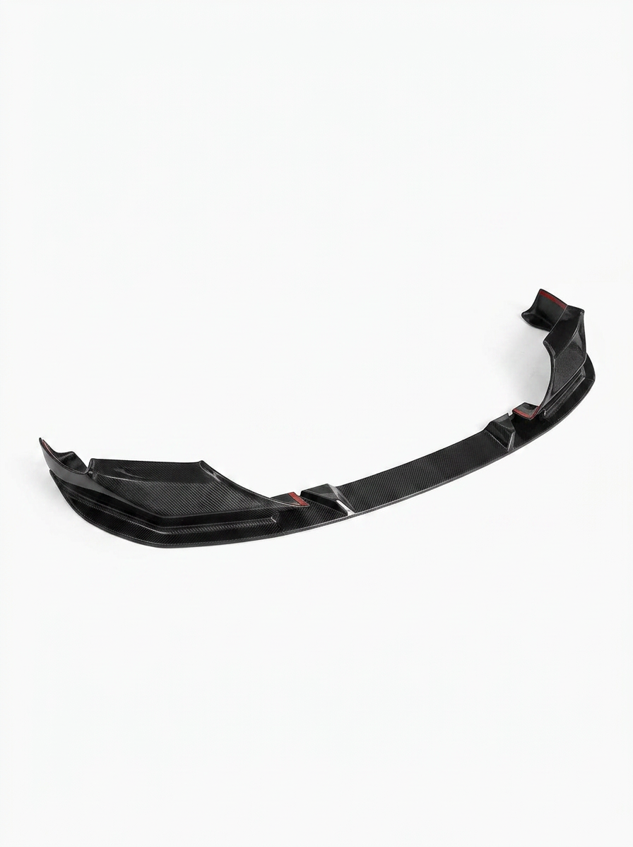 BMW 5 Series F90 M5 3D Style carbon fiber front lip by K2 Industries, showing the sleek textured design on the vehicle's front bumper.