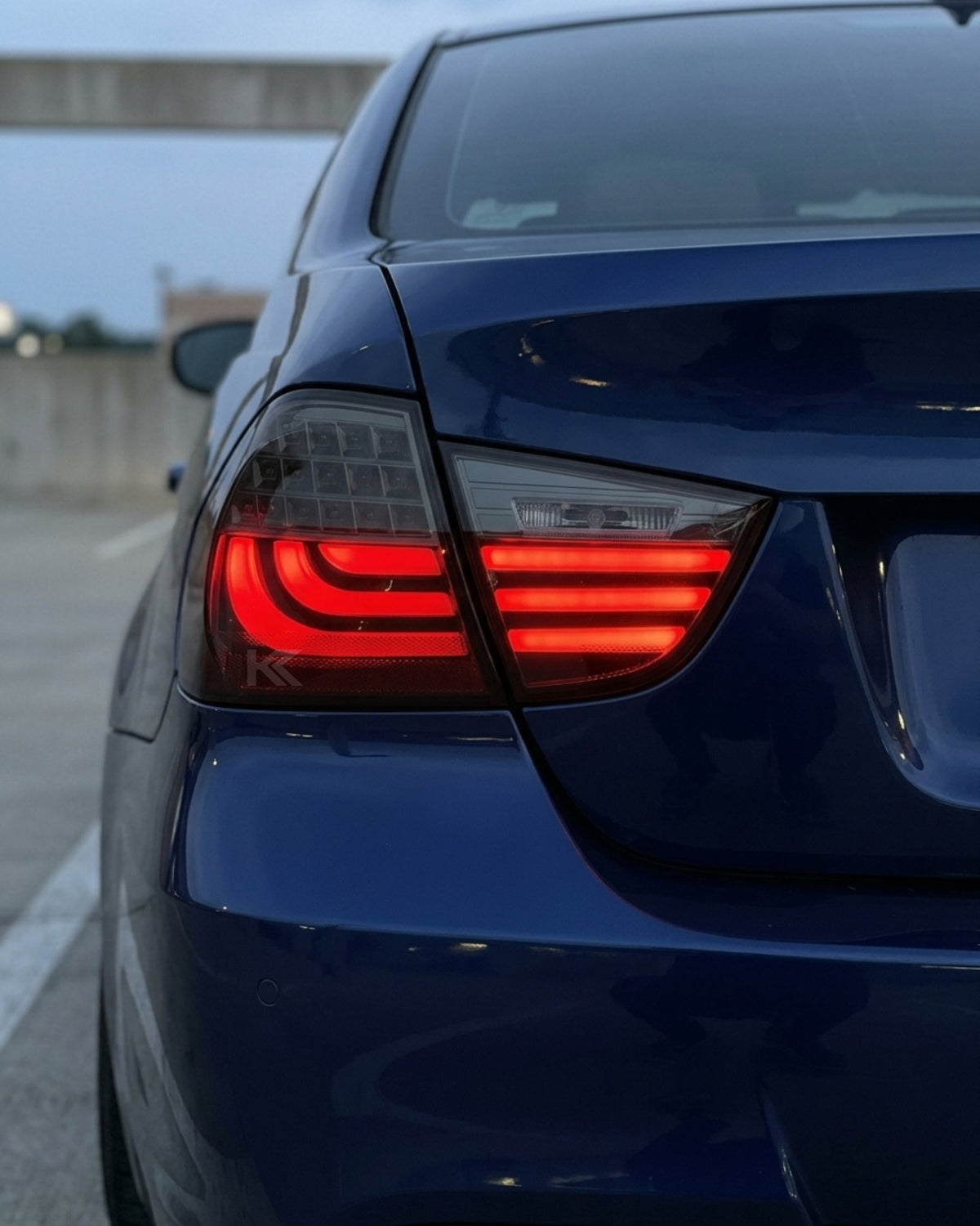 BMW 3 Series E90 upgraded LED tail light assembly by K2 Industries, showing the sleek, modern tail light design for 2009-2012 models.