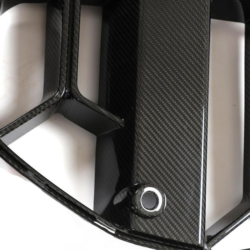Carbon fiber kidney grille for BMW G80 M3 and G82/G83 M4 by Palenon Performance, showing the sleek, textured design.