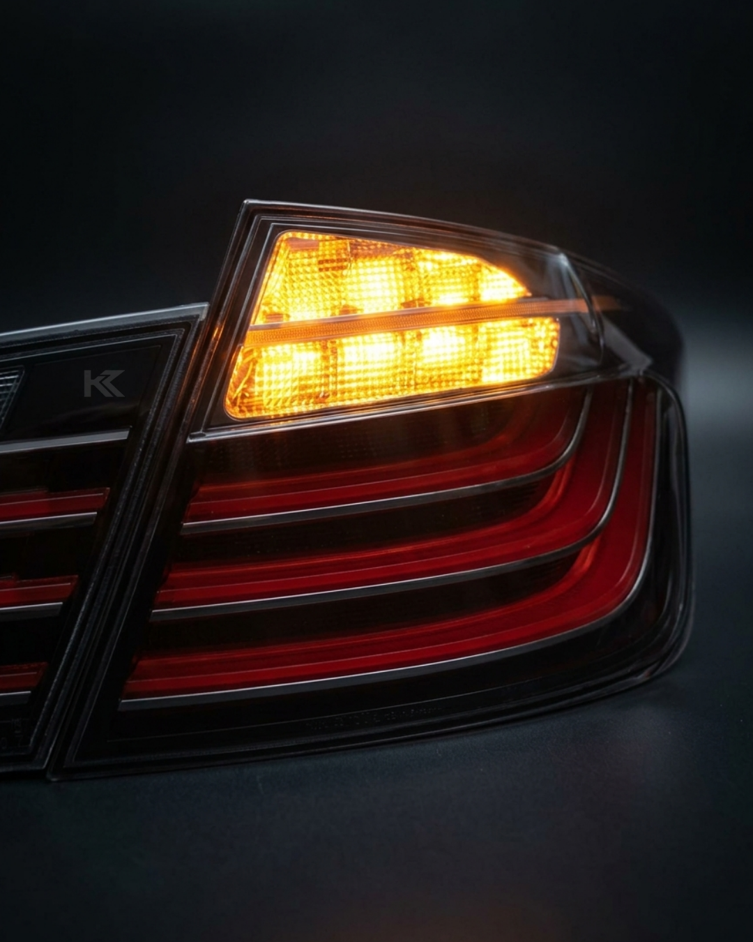 Black BMW 5 Series F10 LED tail lights from K2 Industries, featuring sleek design and modern lighting elements.