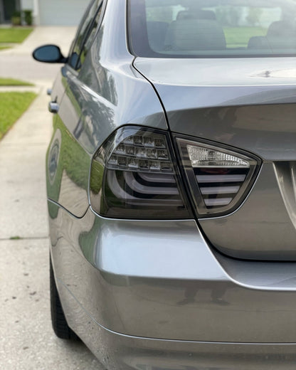 BMW 3-Series E90 tail light upgrade by K2 Industries showing a close-up of the sleek red and clear tail light assembly.
