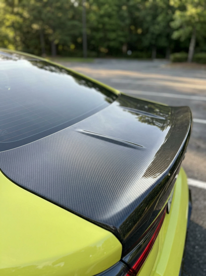 BMW 4 Series G82 carbon fiber CSL trunk by K2 Industries, showing sleek, lightweight carbon fiber material and aerodynamic design.