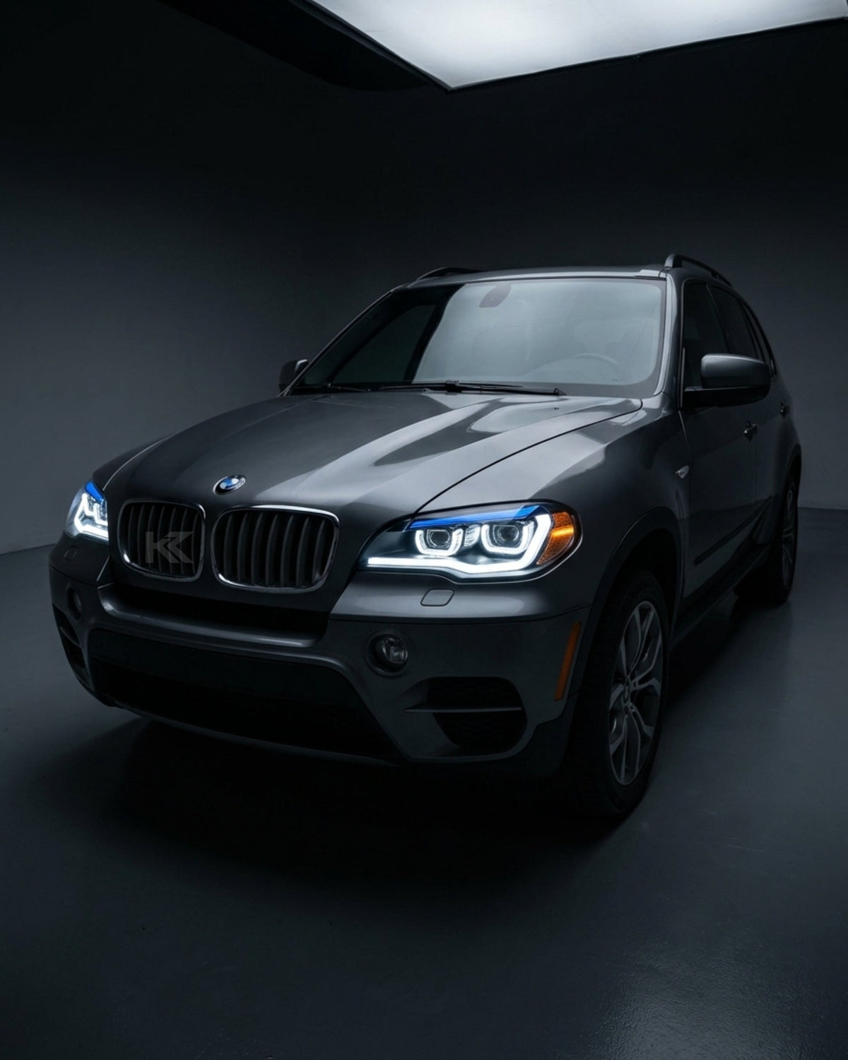 BMW X5 E70 LED headlights upgrade by K2 Industries, showing a close-up of the high-performance headlight assembly with LED bulbs.